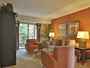 Large living room with private balcony at Liberty Gardens Apartments, Baltimore, MD